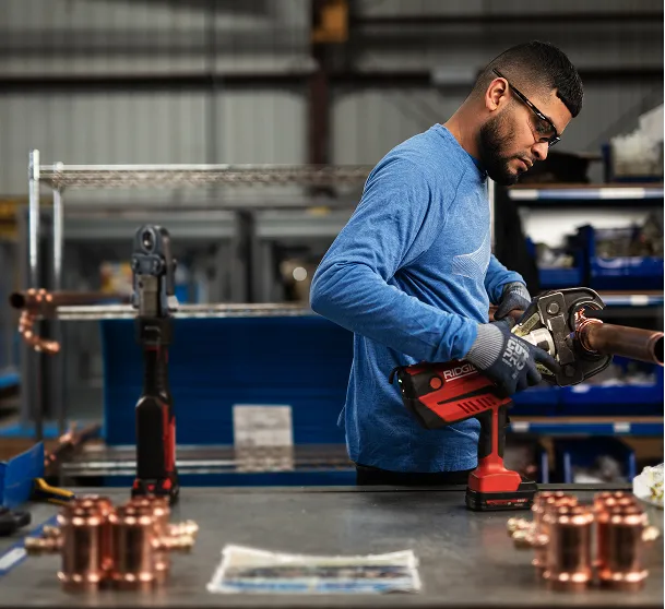 Munters' equipment manufacturer in safety googles and blue shirt.