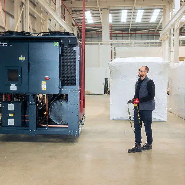 Munters' engineer standing next to a data center dry cooler.