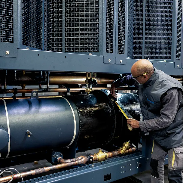 Employee working at a Munters liquid cooling equipment manufacturing facility